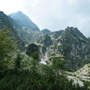 Stunning view of the Tatra Mountains under a cloudy sky, highlighting natural beauty.